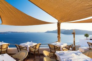 restaurant on terrace with view on sea, Santorini island, Cyclades, Greece